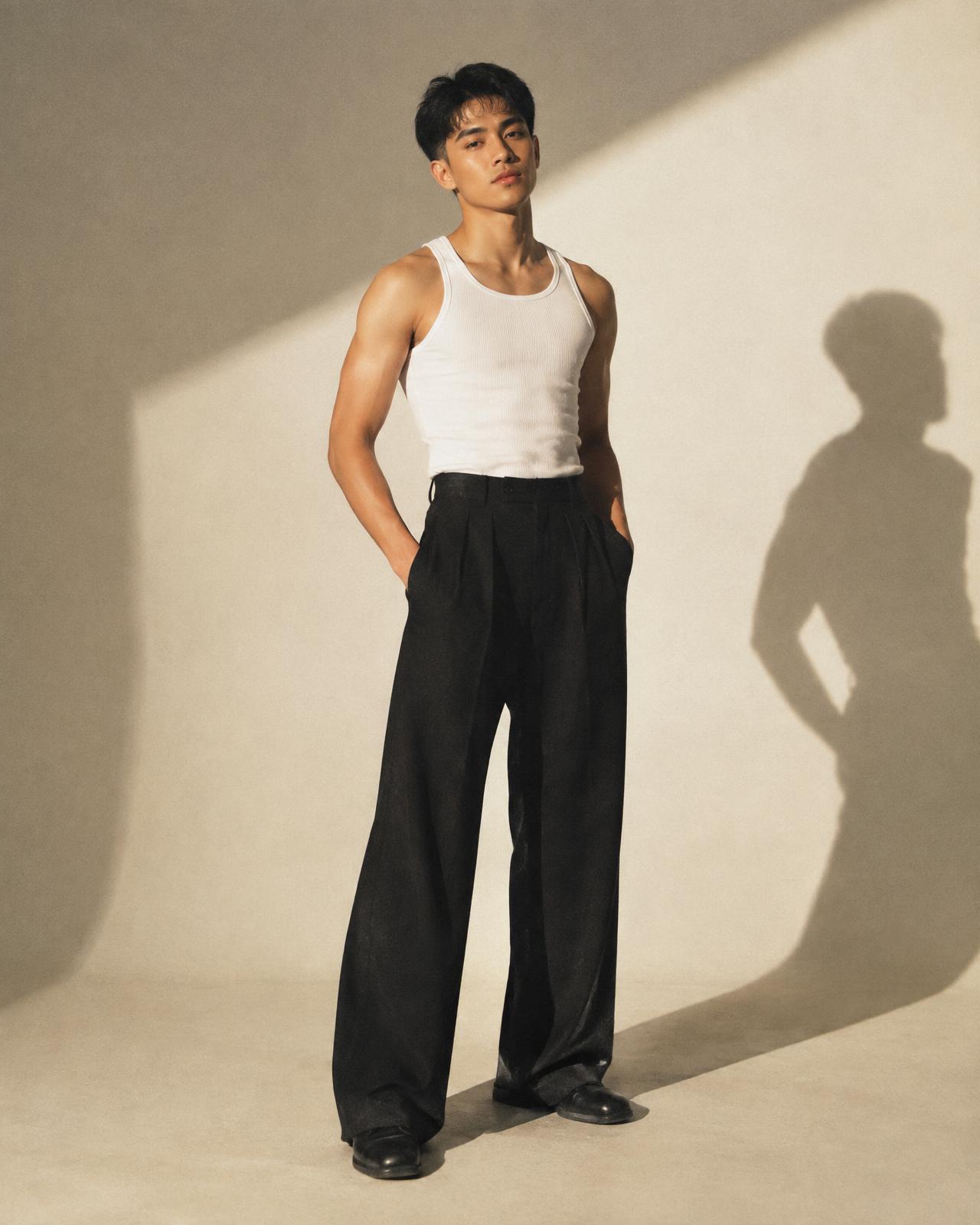 Nico Reyes standing in a sunlit studio